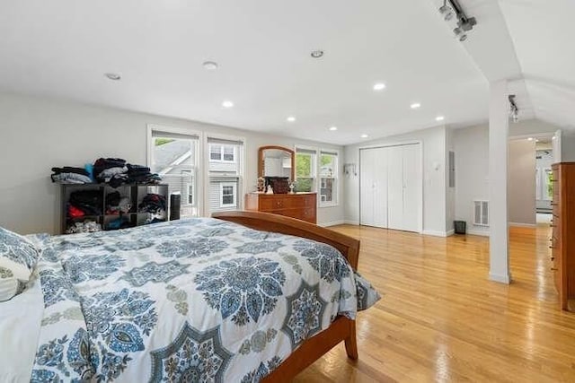 29 Daniels St Unit 29, Arlington, MA 02476 - bedroom with track lighting, light wood-style floors, recessed lighting, a closet, and baseboards