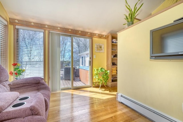 entryway featuring a baseboard radiator and light wood-style flooring