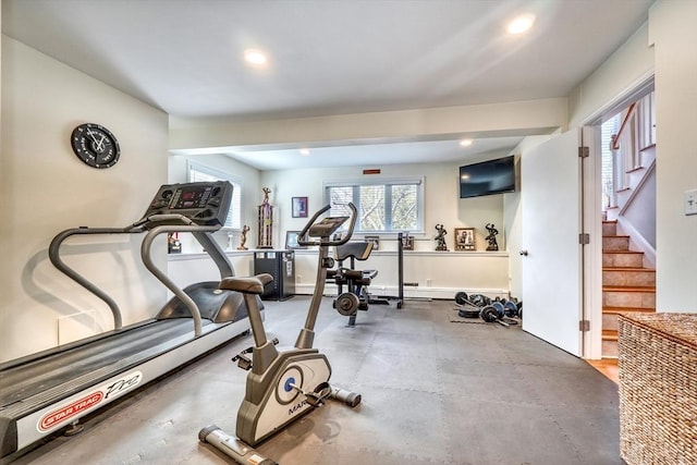 exercise room with recessed lighting and baseboards