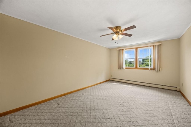 carpeted empty room featuring a baseboard heating unit, baseboards, ceiling fan, and ornamental molding