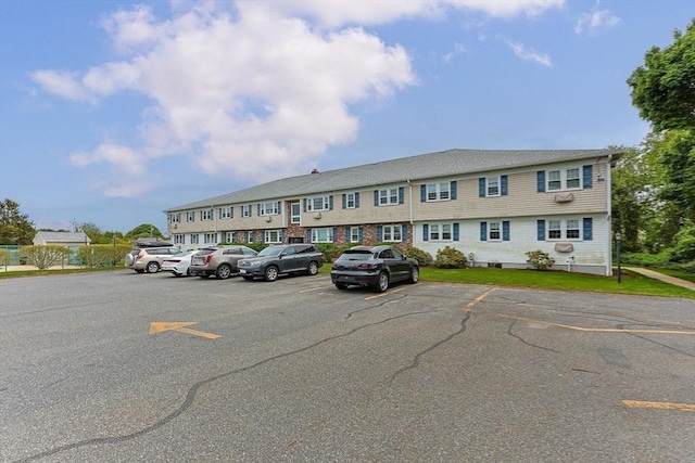 view of property featuring uncovered parking