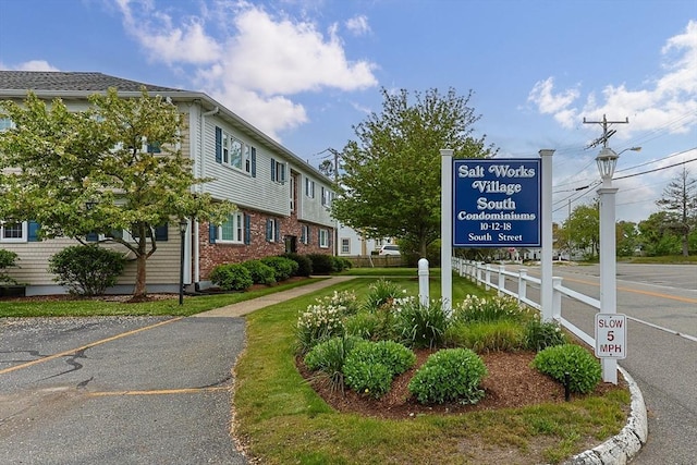 view of property's community with uncovered parking