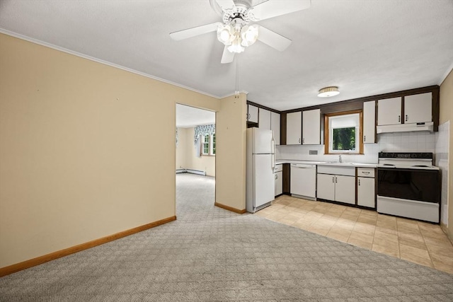 kitchen with white appliances, light countertops, light carpet, crown molding, and baseboards