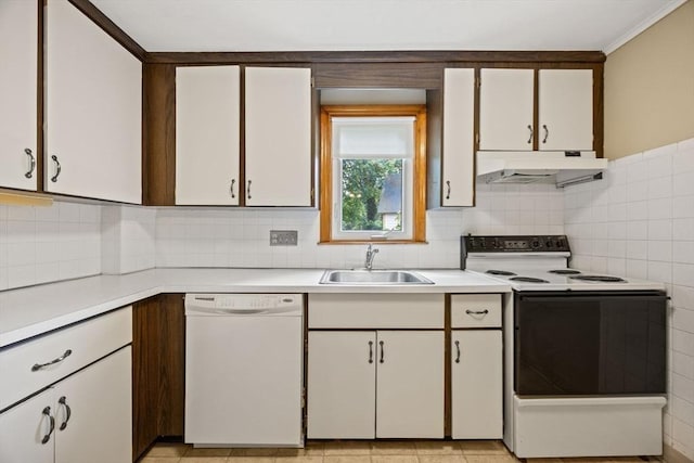 kitchen with dishwasher, electric stove, under cabinet range hood, a sink, and light countertops