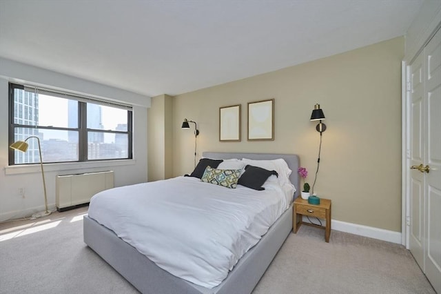 6 Whittier Pl Unit 10H, Boston, MA 02114 - carpeted bedroom with radiator heating unit and baseboards
