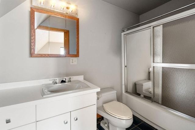 full bathroom featuring combined bath / shower with glass door, toilet, and vanity