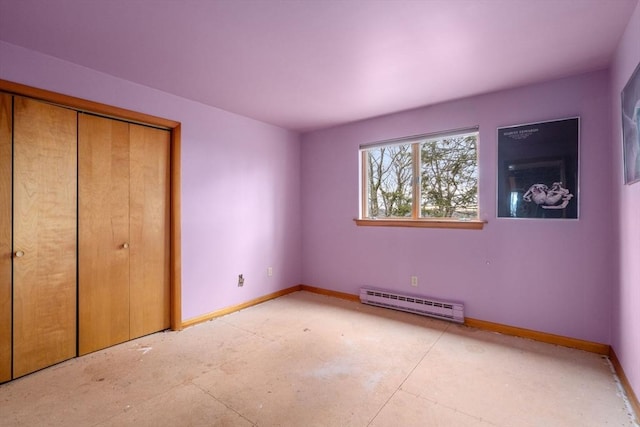 unfurnished bedroom with a baseboard radiator, baseboards, and a closet