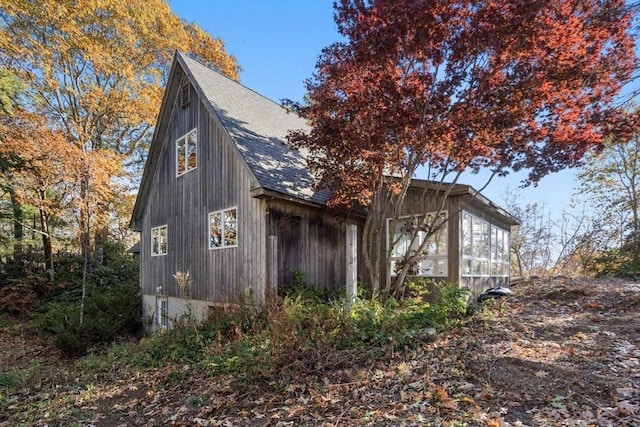 view of home's exterior featuring a shingled roof