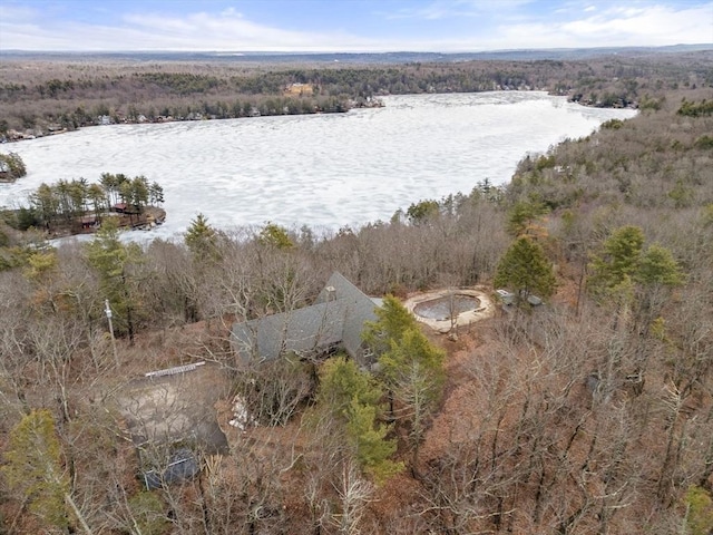 birds eye view of property with a wooded view