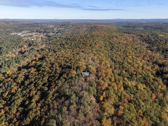 aerial view featuring a wooded view