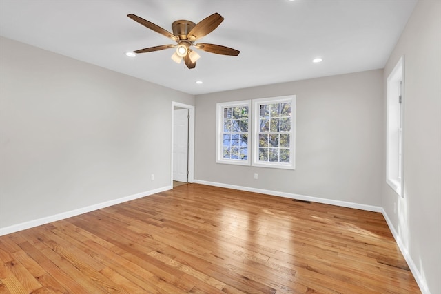 spare room featuring light hardwood / wood-style floors and ceiling fan