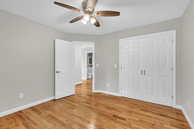 unfurnished bedroom with light hardwood / wood-style floors, a closet, and ceiling fan