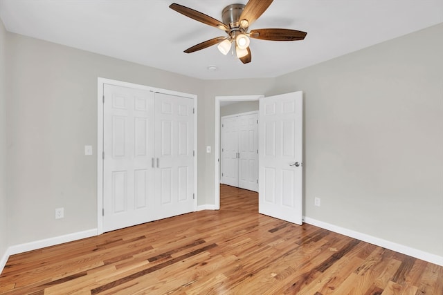 unfurnished bedroom featuring light wood-type flooring and ceiling fan