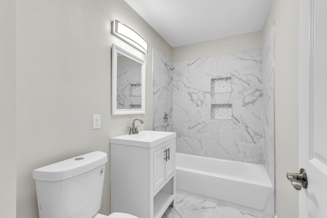 full bathroom with vanity, tiled shower / bath, and toilet