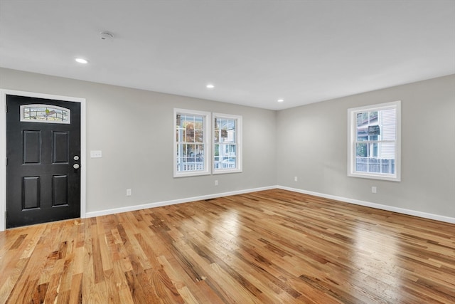 foyer featuring a wealth of natural light and light wood-type flooring