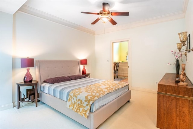 bedroom featuring crown molding, baseboards, and light carpet