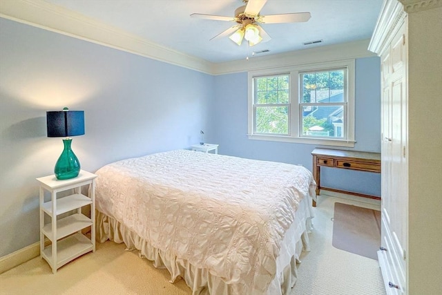 bedroom featuring light carpet, visible vents, crown molding, and ceiling fan