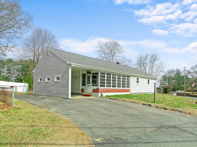 301 Main St, Acushnet, MA 02743 - rear view of house featuring driveway, a lawn, a shingled roof, and a carport