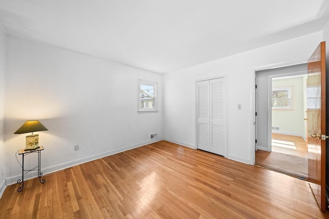 301 Main St, Acushnet, MA 02743 - unfurnished bedroom with light wood-style flooring, baseboards, and a closet