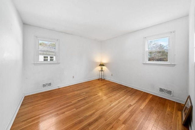 301 Main St, Acushnet, MA 02743 - empty room featuring light wood-style flooring, plenty of natural light, and baseboards