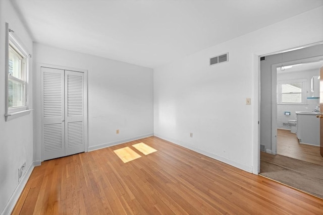 301 Main St, Acushnet, MA 02743 - unfurnished bedroom featuring light wood-style flooring, a closet, and baseboards
