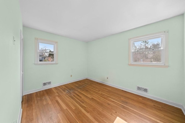 301 Main St, Acushnet, MA 02743 - empty room featuring hardwood / wood-style floors and baseboards