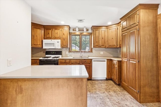 16 River Rd, Hanover, MA 02339 - kitchen with white appliances, a peninsula, light countertops, decorative backsplash, and recessed lighting