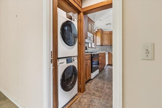 16 River Rd, Hanover, MA 02339 - washroom with stacked washer / drying machine