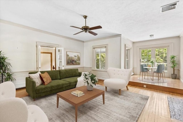 16 River Rd, Hanover, MA 02339 - living area featuring healthy amount of natural light, ceiling fan, wood-type flooring, ornamental molding, and a textured ceiling