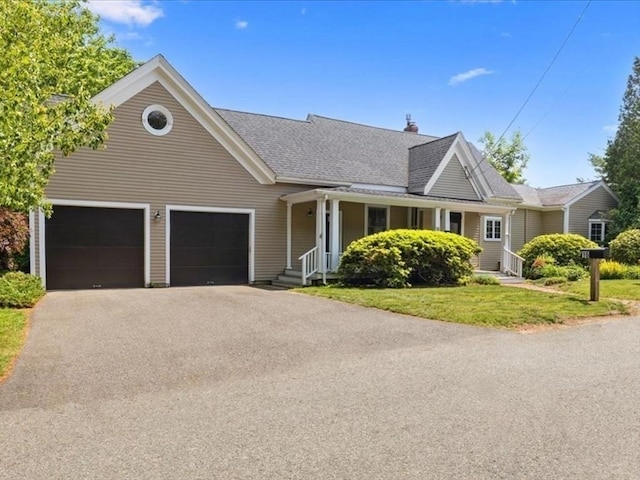 16 River Rd, Hanover, MA 02339 - view of front of house with a garage, asphalt driveway, a front lawn, a shingled roof, and a chimney