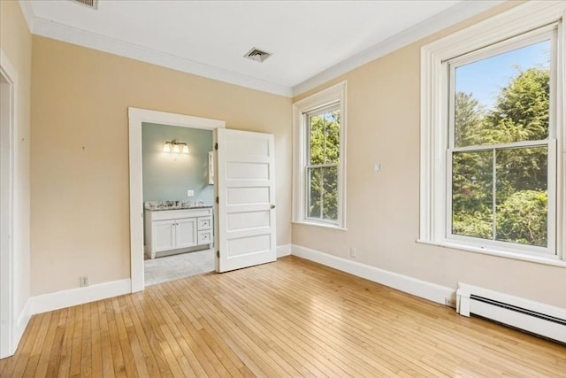 16 River Rd, Hanover, MA 02339 - unfurnished room with baseboard heating, light wood-style flooring, and crown molding