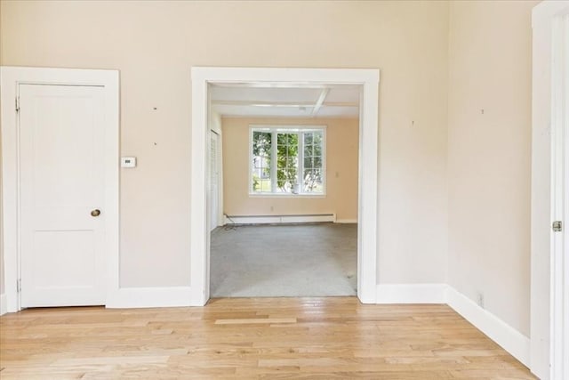 16 River Rd, Hanover, MA 02339 - unfurnished room featuring a baseboard heating unit and light wood-style flooring