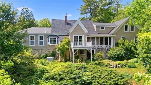 16 River Rd, Hanover, MA 02339 - back of property with a sunroom, a chimney, and roof with shingles