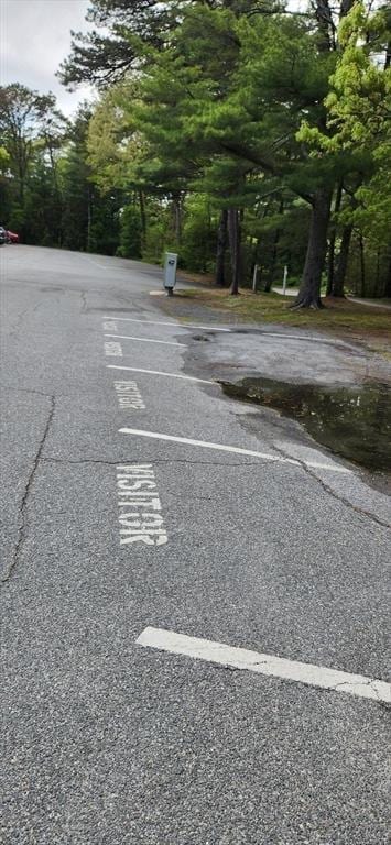 70 Cape Dr Unit 12C, Mashpee, MA 02649 - uncovered parking lot with view of scattered trees
