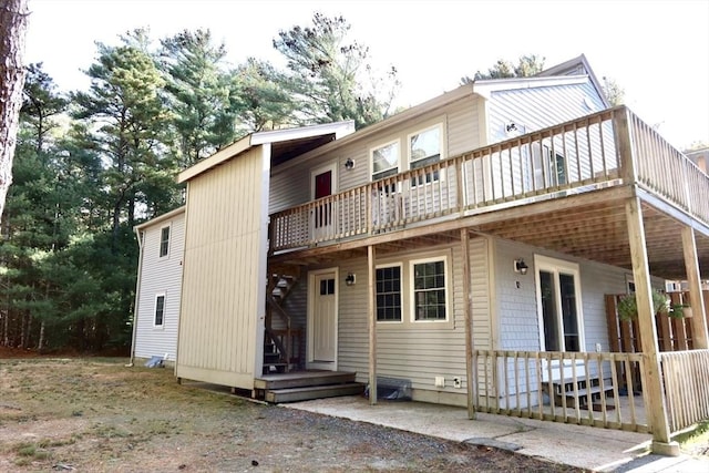 70 Cape Dr Unit 12C, Mashpee, MA 02649 - back of house with a wooden deck