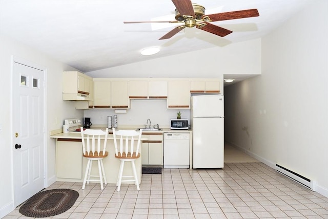 70 Cape Dr Unit 12C, Mashpee, MA 02649 - kitchen with white appliances, baseboard heating, lofted ceiling, a sink, and light countertops