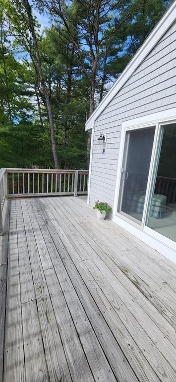 70 Cape Dr Unit 12C, Mashpee, MA 02649 - deck featuring view of wooded area