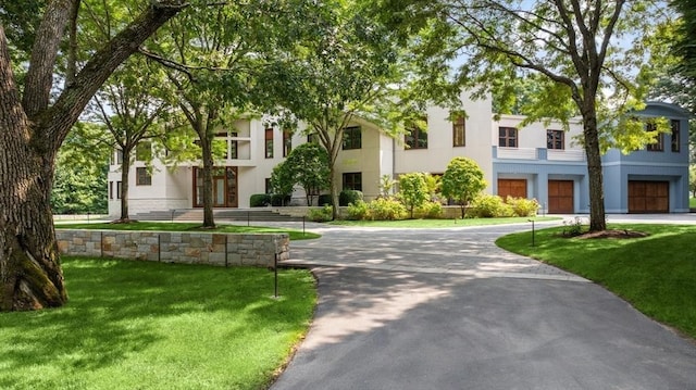 view of front of property with a front lawn and stucco siding