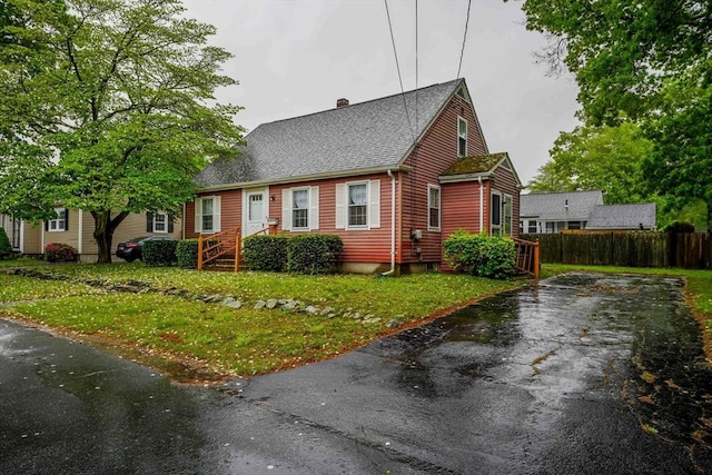 58 Huntington Ave, Dartmouth, MA 02747 - new england style home with a chimney, driveway, and a shingled roof