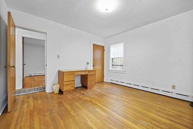 58 Huntington Ave, Dartmouth, MA 02747 - unfurnished bedroom featuring baseboard heating and light wood-style floors
