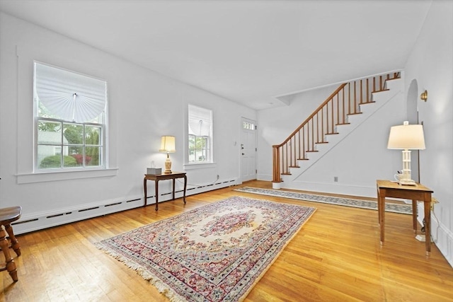 58 Huntington Ave, Dartmouth, MA 02747 - entrance foyer featuring a baseboard heating unit, stairs, and wood-type flooring