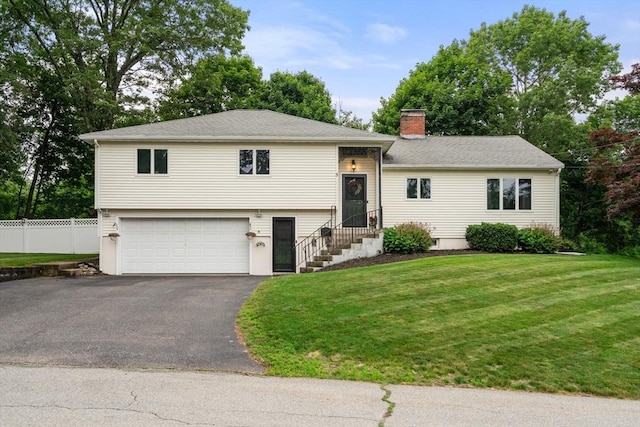 5 Cutler Rd, Paxton, MA 01612 - tri-level home with a garage, a chimney, and asphalt driveway