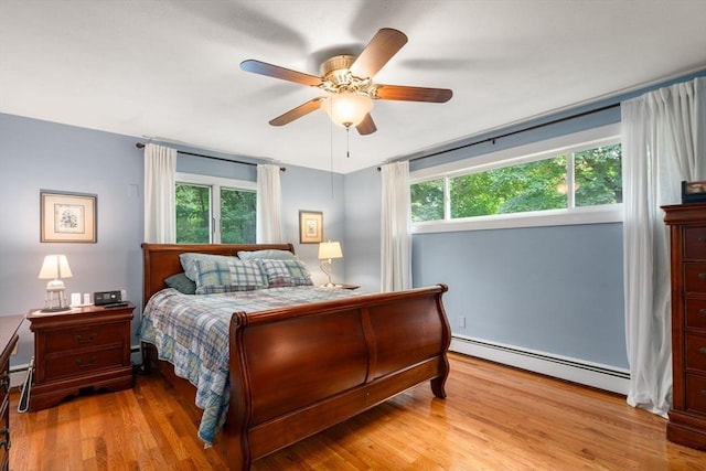 5 Cutler Rd, Paxton, MA 01612 - bedroom with baseboard heating, multiple windows, wood finished floors, and a ceiling fan