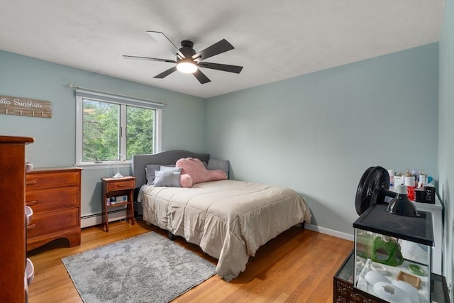 5 Cutler Rd, Paxton, MA 01612 - bedroom with a baseboard radiator, wood finished floors, and a ceiling fan