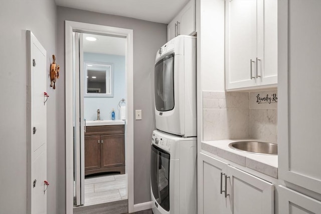 5 Cutler Rd, Paxton, MA 01612 - laundry area featuring stacked washer and clothes dryer, cabinet space, and recessed lighting