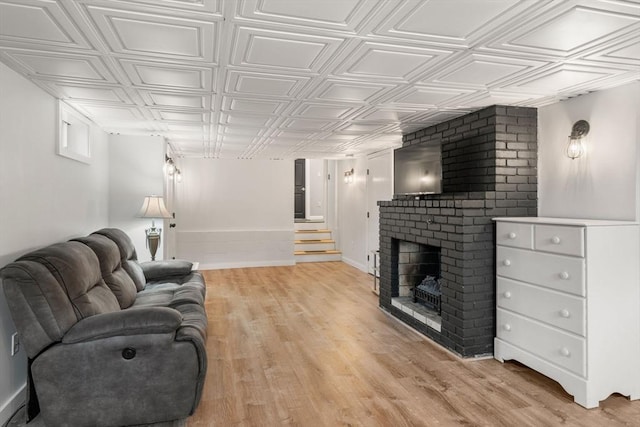 5 Cutler Rd, Paxton, MA 01612 - living area with a brick fireplace, an ornate ceiling, and light wood-style flooring