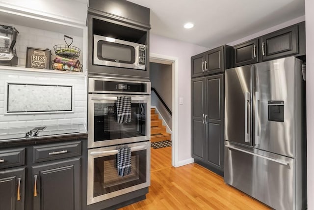 5 Cutler Rd, Paxton, MA 01612 - kitchen with appliances with stainless steel finishes, dark countertops, backsplash, light wood-type flooring, and recessed lighting