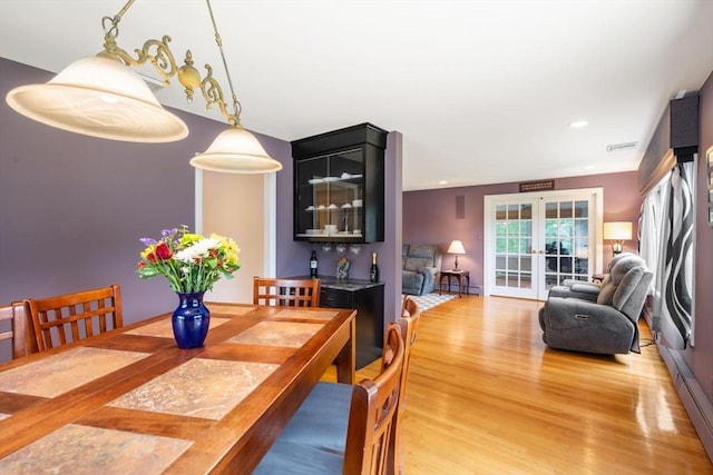 5 Cutler Rd, Paxton, MA 01612 - dining area featuring light wood-type flooring, french doors, recessed lighting, and a baseboard heating unit