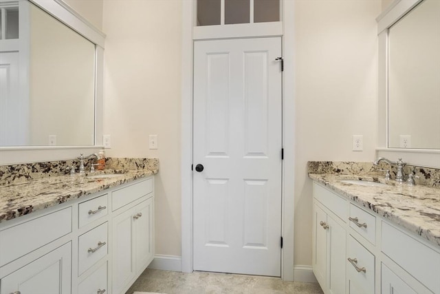 81 Hanover Rd, Carlisle, MA 01741 - bathroom with two vanities and baseboards