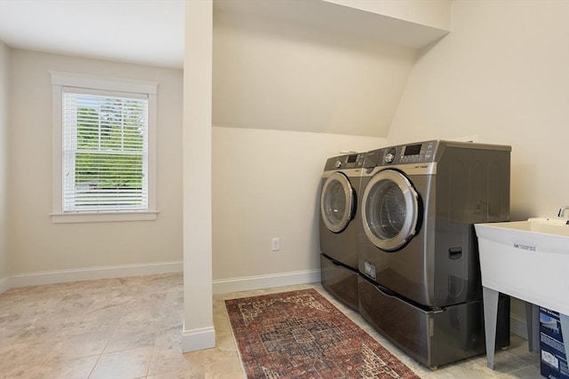 81 Hanover Rd, Carlisle, MA 01741 - laundry room with washer and dryer, baseboards, and tile patterned floors